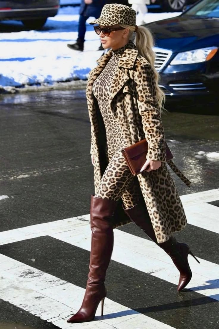 Editorial street style in a leopard-print coat and burgundy boots